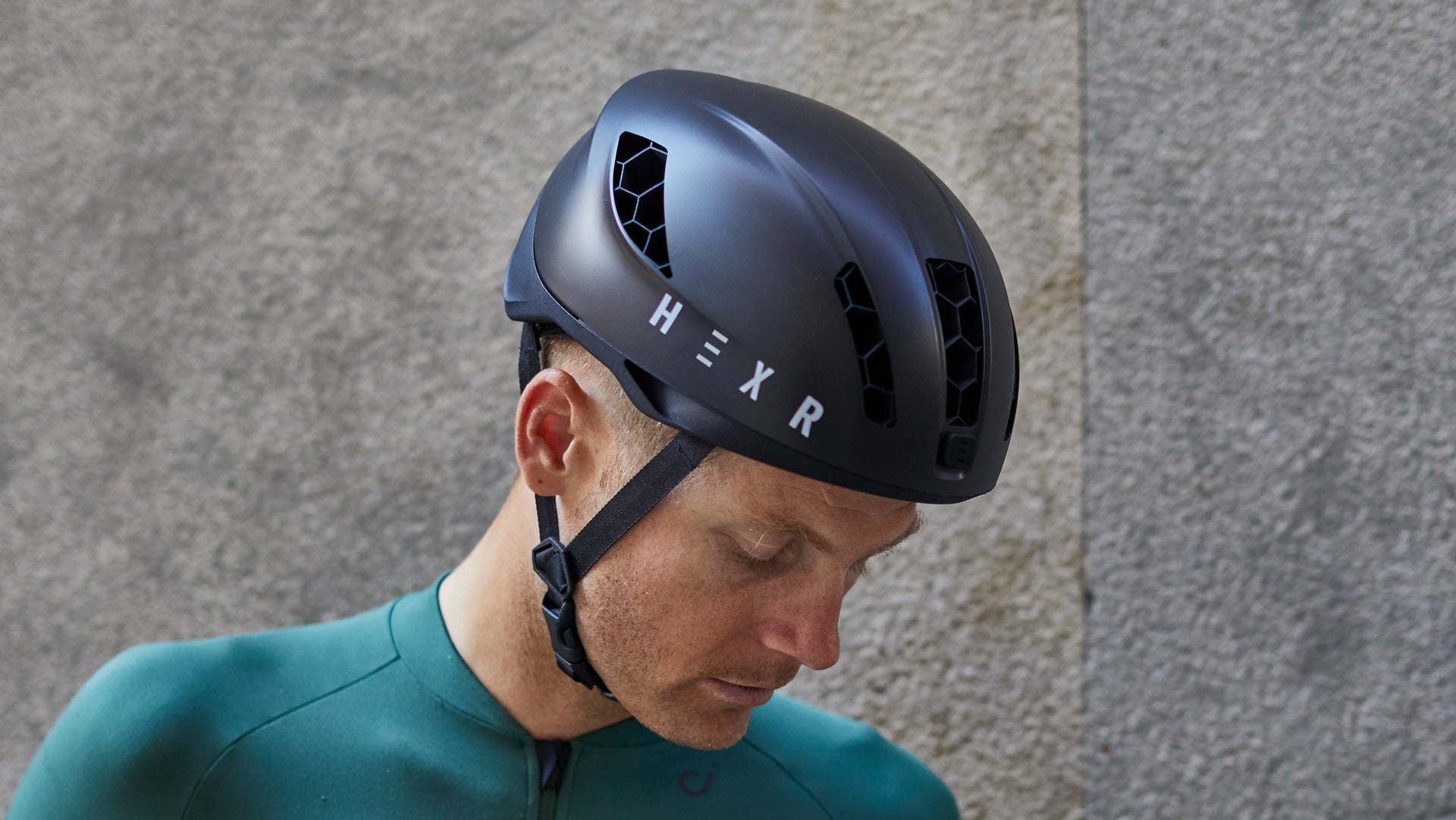 Man looking down wearing a HEXR helmet.
